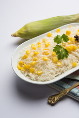 Corn Rice made using boiled Maize seeds with basmati rice, served in a bowl. selective focus 