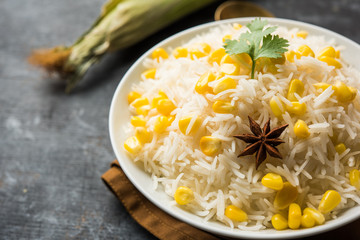 Corn Rice made using boiled Maize seeds with basmati rice, served in a bowl. selective focus 