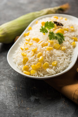 Corn Rice made using boiled Maize seeds with basmati rice, served in a bowl. selective focus 