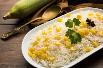 Corn Rice made using boiled Maize seeds with basmati rice, served in a bowl. selective focus 