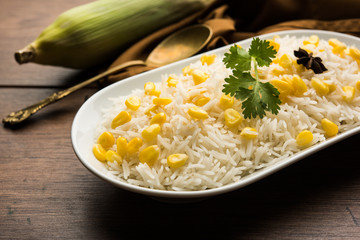 Corn Rice made using boiled Maize seeds with basmati rice, served in a bowl. selective focus 