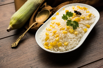 Corn Rice made using boiled Maize seeds with basmati rice, served in a bowl. selective focus 