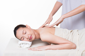 Obraz premium Body Massage on specific naked back of Asian woman by pressing fingers on pain or stress muscle point to release relax. Therapist Spa body massage woman hands treatment on customer, isolated on white