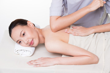 Obraz na płótnie Canvas Body Massage on specific naked back of Asian woman by pressing fingers on pain or stress muscle point to release relax. Therapist Spa body massage woman hands treatment on customer