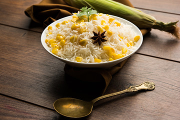 Corn Rice made using boiled Maize seeds with basmati rice, served in a bowl. selective focus 