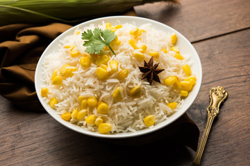 Corn Rice made using boiled Maize seeds with basmati rice, served in a bowl. selective focus 