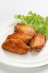 Close up deep-fried chicken wings with sweet source