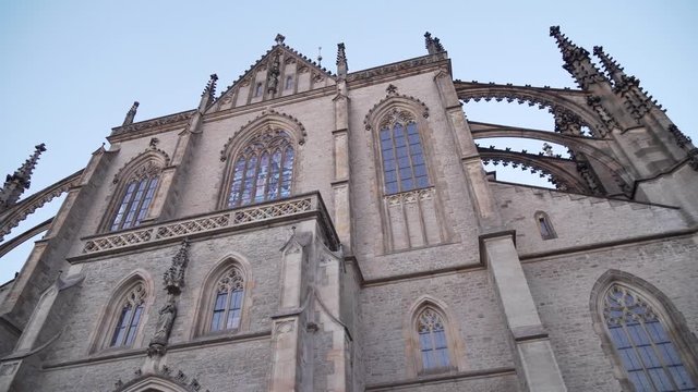 Gothic windows of St. Barbara's Church in Kutna Hora, Czech Republic, panning right up shot
