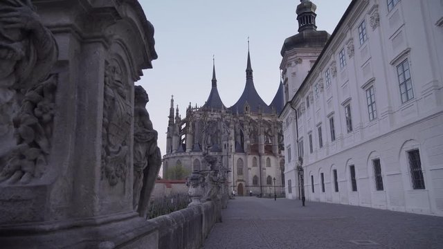 St. Barbara's Cathedral in Kutna Hora, Czech Republic, panning right over statue, evening shot