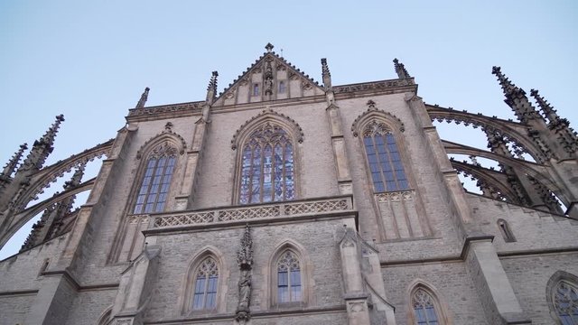 Gothic windows of St. Barbara's Cathedral in Kutna Hora, Czech Republic, panning left up shot
