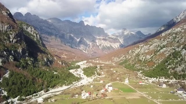 The beauty of the Albania alps flying down the valley with the Albanian Alps mountain range in the background