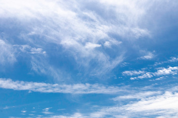 Naklejka na ściany i meble White clouds on a blue sky.