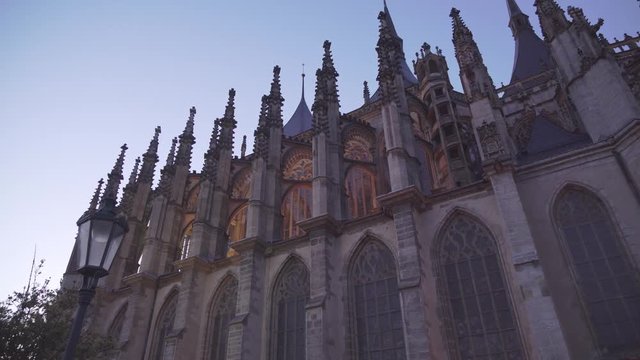 Towers and windows of St. Barbara's Cathedral in Kutna Hora, Czech Republic, evening shot with lights
