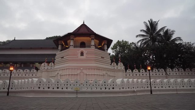 Panning shot across Sri Lanka Beautiful architecture of Buddhist temple in Kandy town. Sacred Buddha Tooth temple or Sri Dalada Maligawa.
