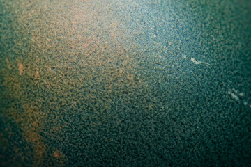 Close-up macro image of a naturally colored Easter egg shell using cabbage creating an interesting texture.