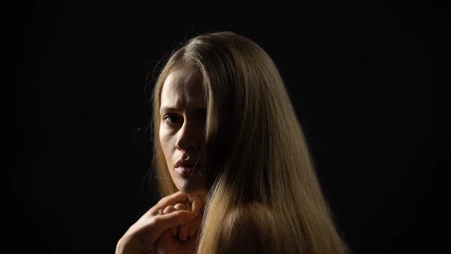 Scared female turning to camera, sexual slavery victim, women discrimination