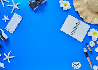 summer traveler beach accessories on blue background