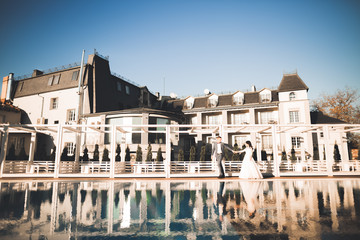 Lovely happy wedding couple, bride with long white dress