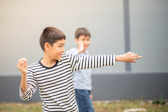 Little boy playing darts board family outdoor activity