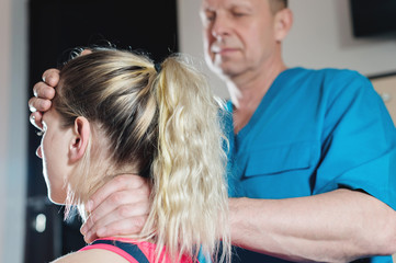 Fototapeta premium The visceral doctor is engaged in manual editing of the skull of a young girl. Alternative medicine. Health Prevention Concept