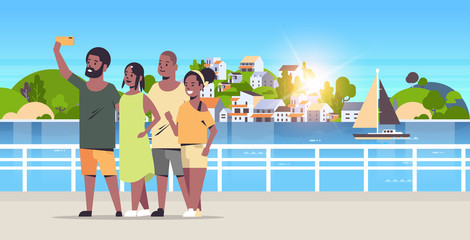 people group taking selfie photo on smartphone camera african american friends standing together mountain city island landscape background holiday travel concept full length horizontal
