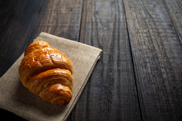 croissants on old wooden table.
