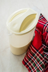 Raw Pancake Dough in Plastic Carafe Ready to Pour on Pan.