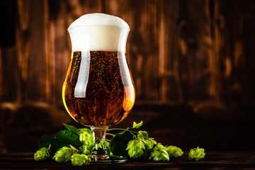 beer glass on dark wooden background