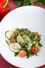 Prepared cucumber and tomato salad