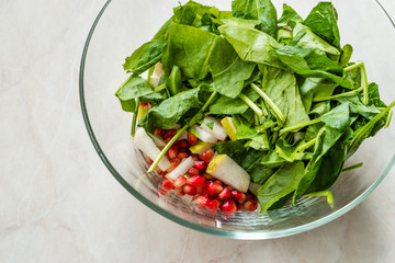 Pomegeranate and Pear Salad in Glass Bowl Ready to Make.