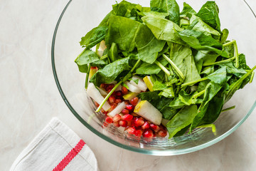 Pomegeranate and Pear Salad in Glass Bowl Ready to Make.