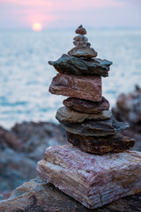 Fototapeta na wymiar Stones tower with sea 