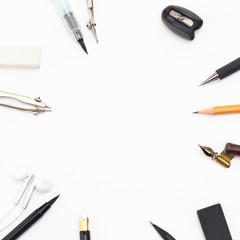 Background with white paper, pencils and eraser. Workplace for the painter. Background to display the logo and lettering. copyspace, space for text. the blogger instrument. Office tools.