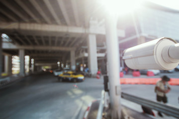 Closed-circuit television,Security CCTV camera or surveillance system in background of International Airport ,Passenger Terminal taxi ,Tropical zone color