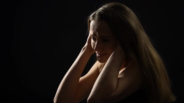 Scared woman holding head and screaming, suffering from panic attack, problems