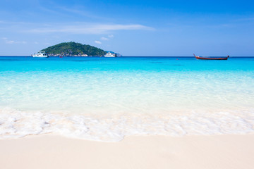 Bright tropical beach and turquoise seawater in summer.