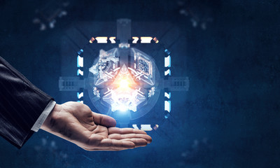 Hand and technology managing concept. Mixed media