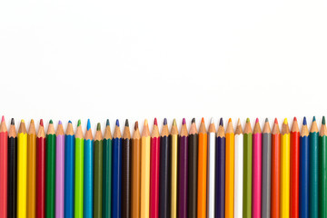 Colour pencils isolated on white background. Back to school concept Wood texture pencil with sharpening shavings on white background pencil on table, the blogger instrument. copyspace, space for text.