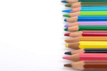 Colour pencils isolated on white background. Back to school concept Wood texture pencil with sharpening shavings on white background pencil on table, the blogger instrument. copyspace, space for text.