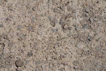 surface or wall with small stones and concrete for background