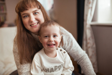 portrait of beautiful woman and her cute little son
