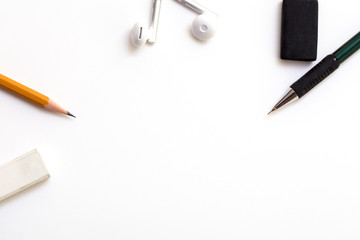 Background with white paper, pencils and eraser. Workplace for the artist. Background to display the logo and lettering. copyspace, space for text. the blogger instrument. Office tools.