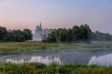 Country landscape in Russia. Misty river at dawn in the village of Dunilovo