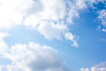 White heap clouds in the blue sky at the summer day.