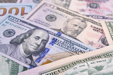 Money USA dollar banknotes for background.Money is any item or verifiable record that is generally accepted as payment for goods and services and repayment of debts