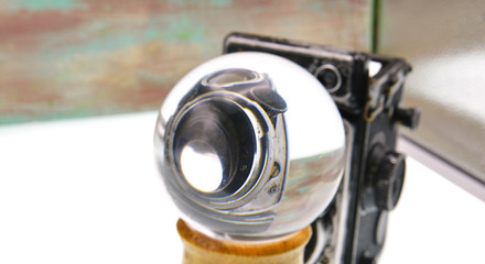 old camera with lens ball
