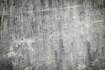 Gray abstract background with scratches and irregularities. Old worn slate sheet. The basis for the layout.