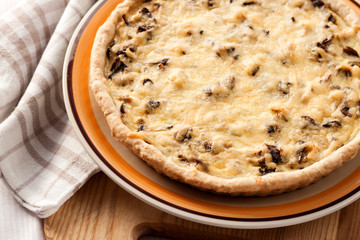 Chicken tart with mushrooms and cheese on a plate