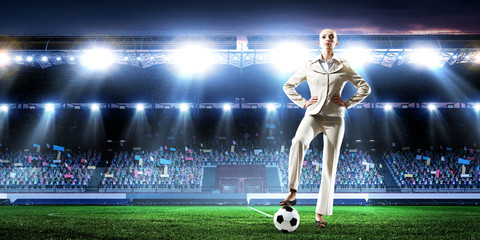 Fototapeta premium Business lady on football stadium. Mixed media