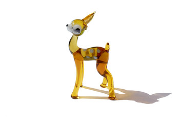 glass figurine fawn with a broken ear isolated on a white background with a shadow